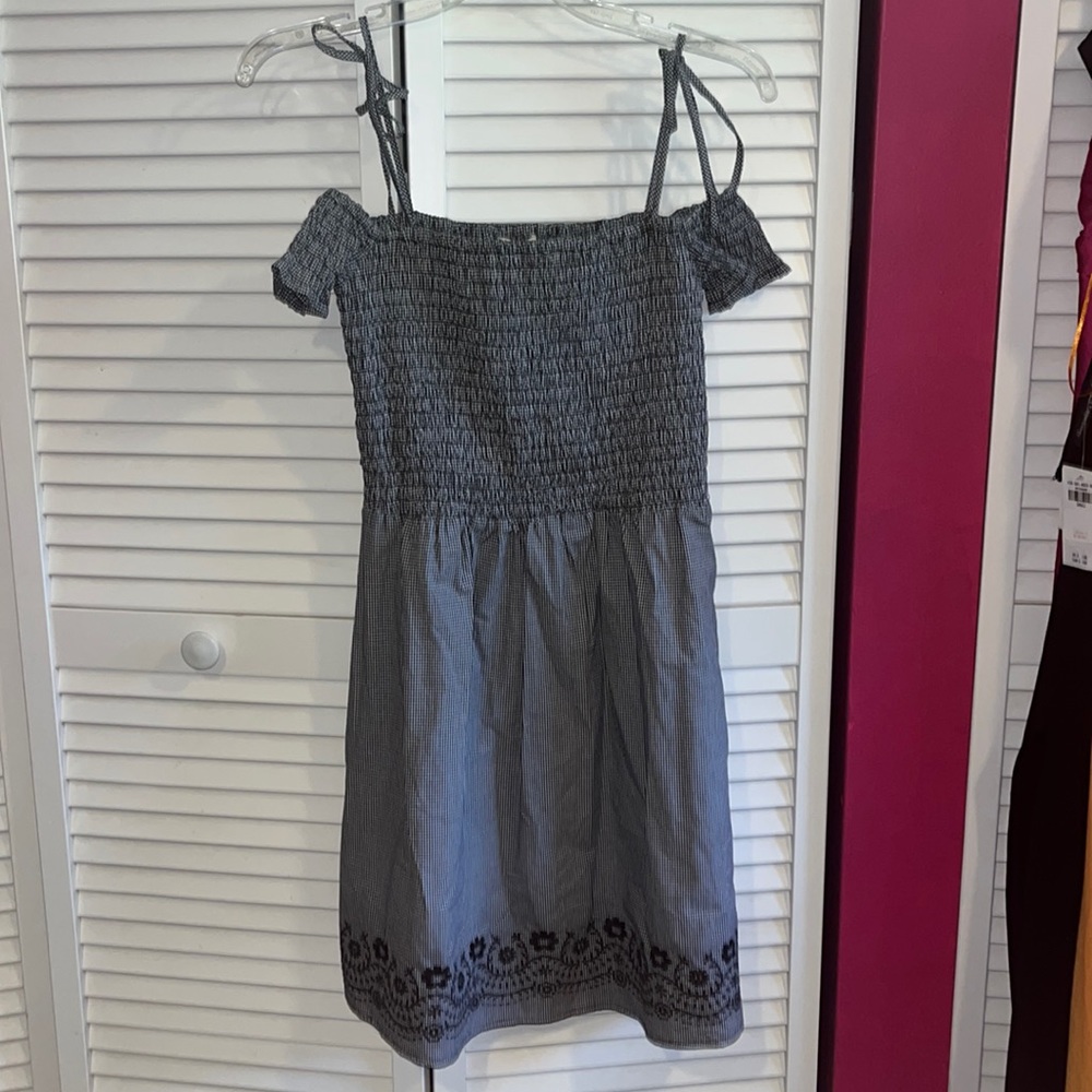 black and white dress with flowers on the trim